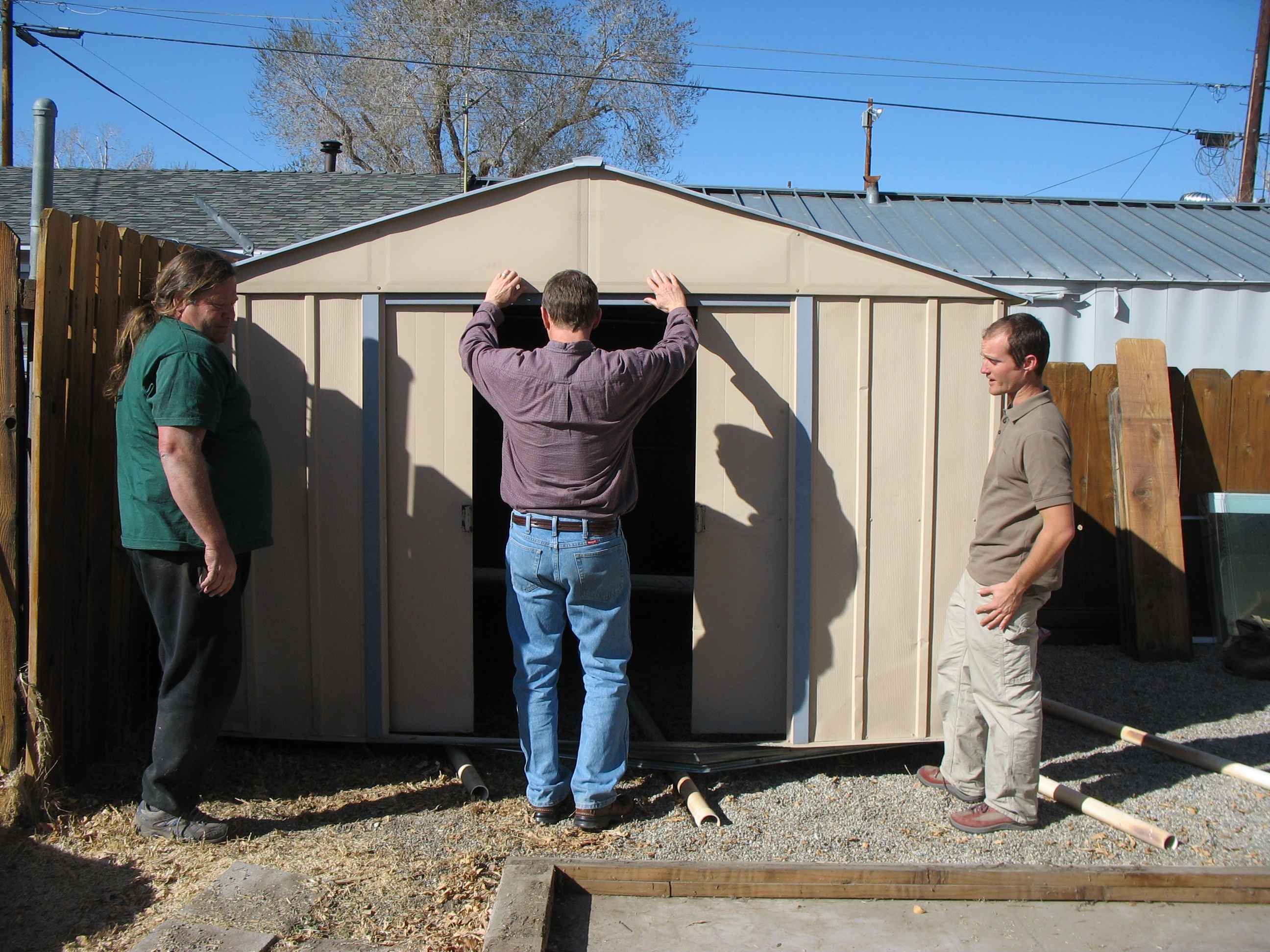 Shed Moving Time Office staff team building exercise, left to right: Dennis, John, and Aaron