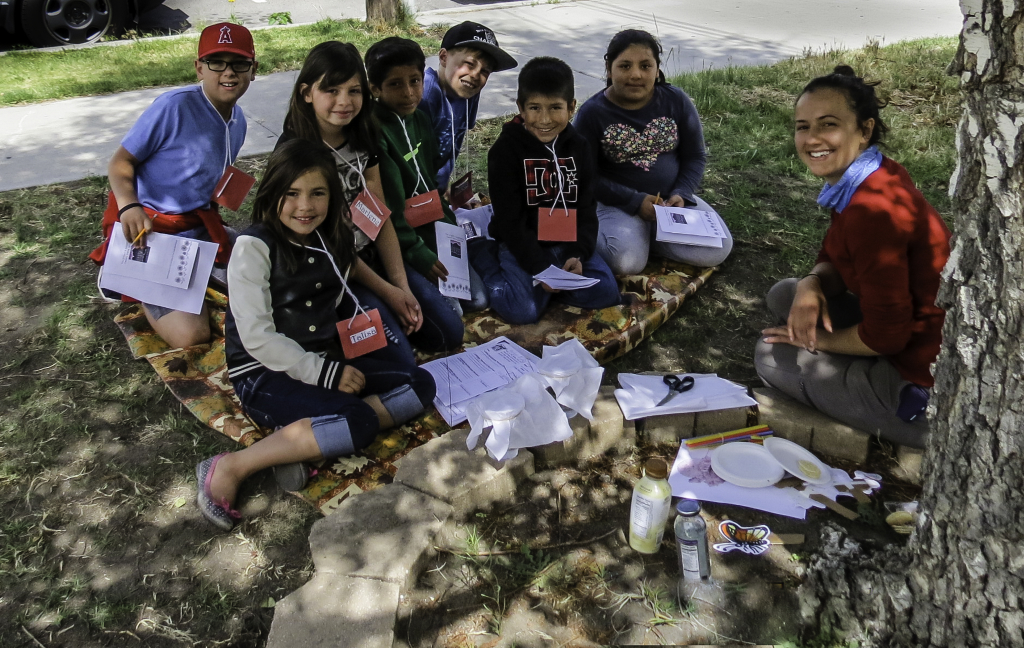 Here, Sara leads a learning activity to teach a group of third graders about how bees and butterflies are keeping the Eastern Sierra blooming.