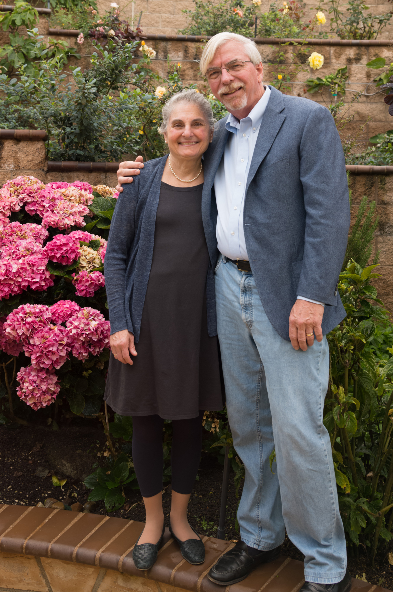 Elaine and Doug Muchmore pose in their garden