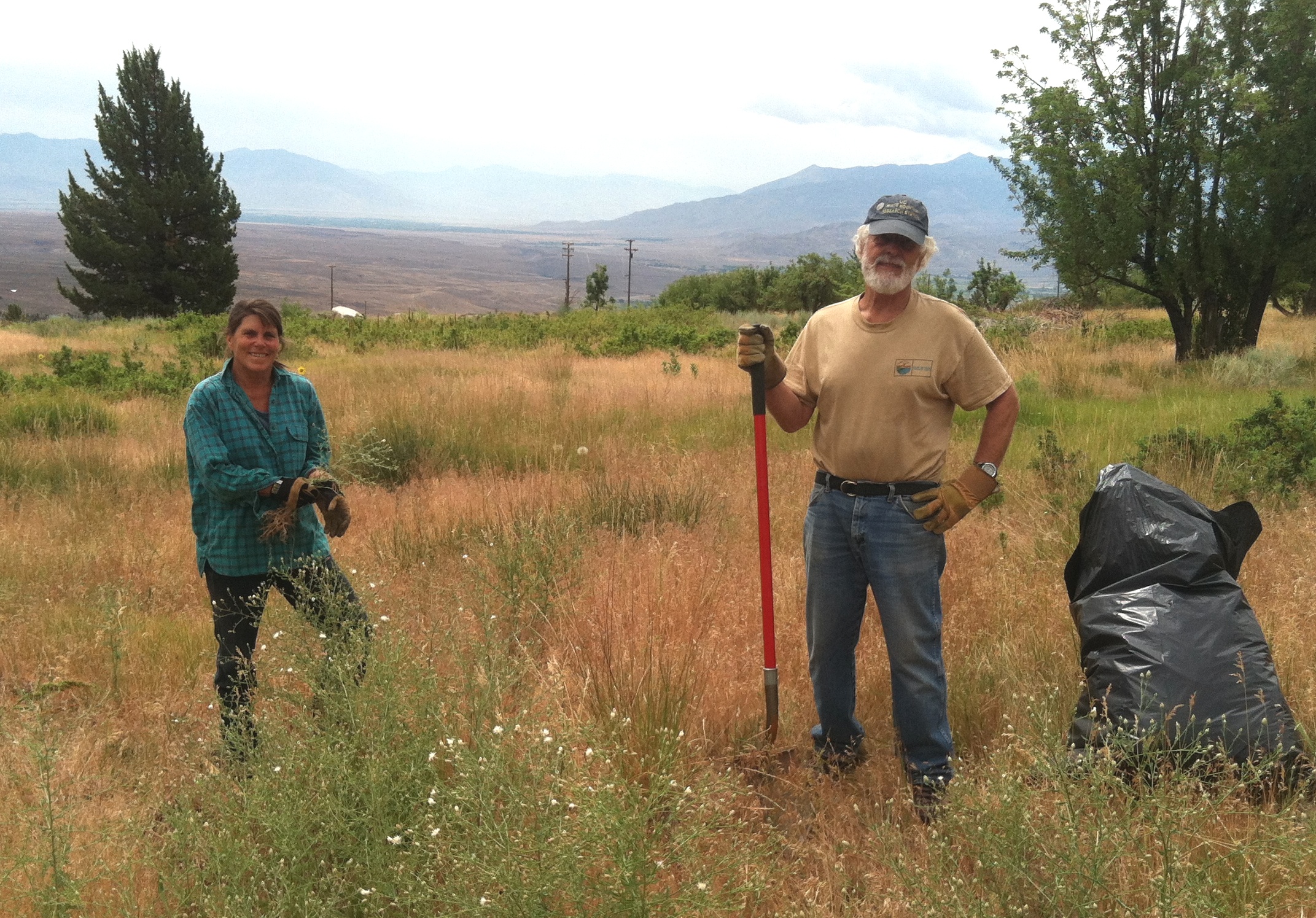 "I love the heavy work of pulling, cutting, and rolling up fences to remove barriers to sage-grouse roaming, especially on such a gorgeous landscape... And a bonus is working with a very delightful group of volunteers." - Wally Woolfenden (right), Stewardship Volunteer with ESLT