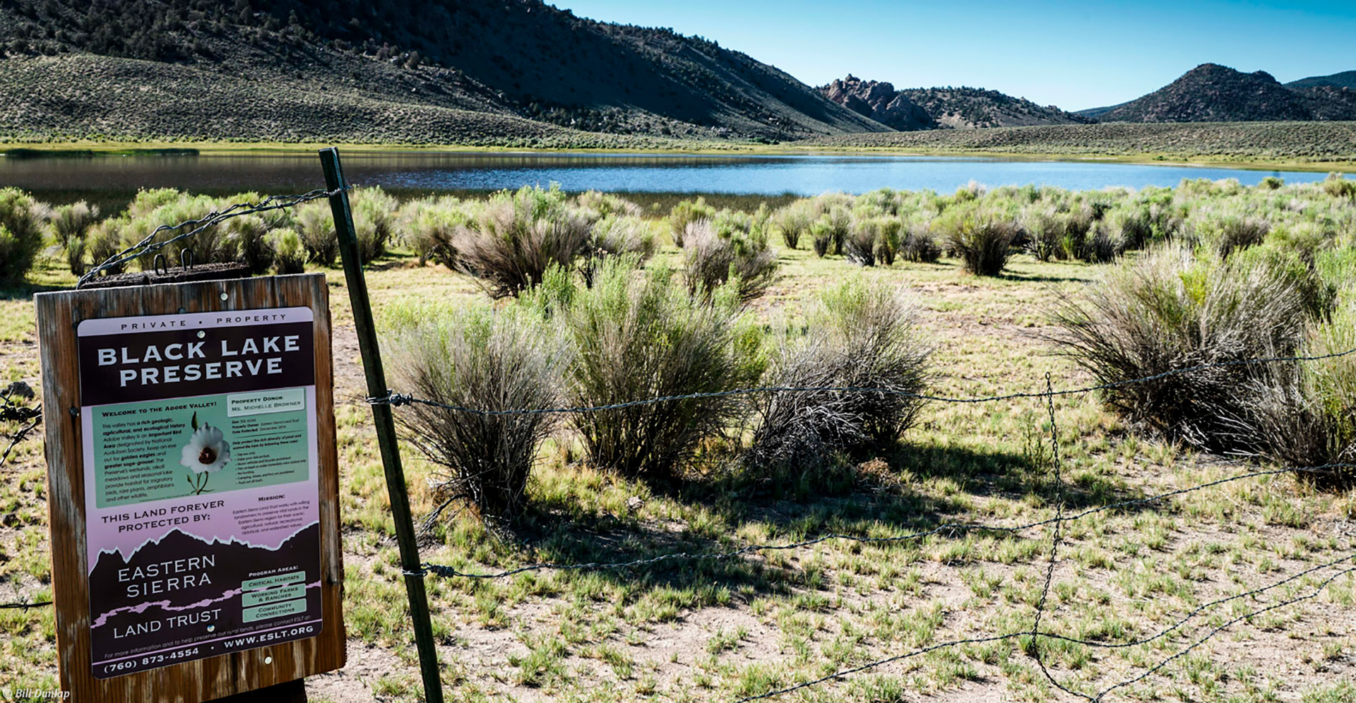 black rock lake in the eastern sierra, sage and a sign in foreground