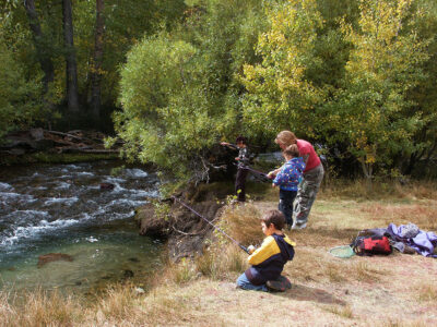 A family fishing by an Eastern Sierra creek