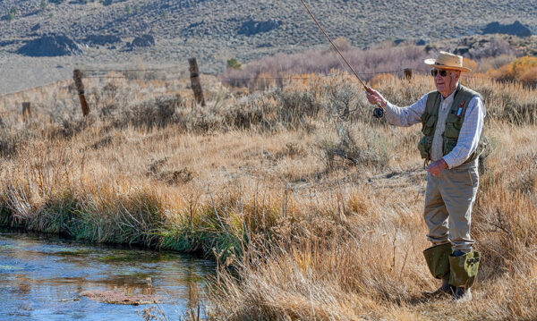A man fishing in an Eastern Sierra creek.